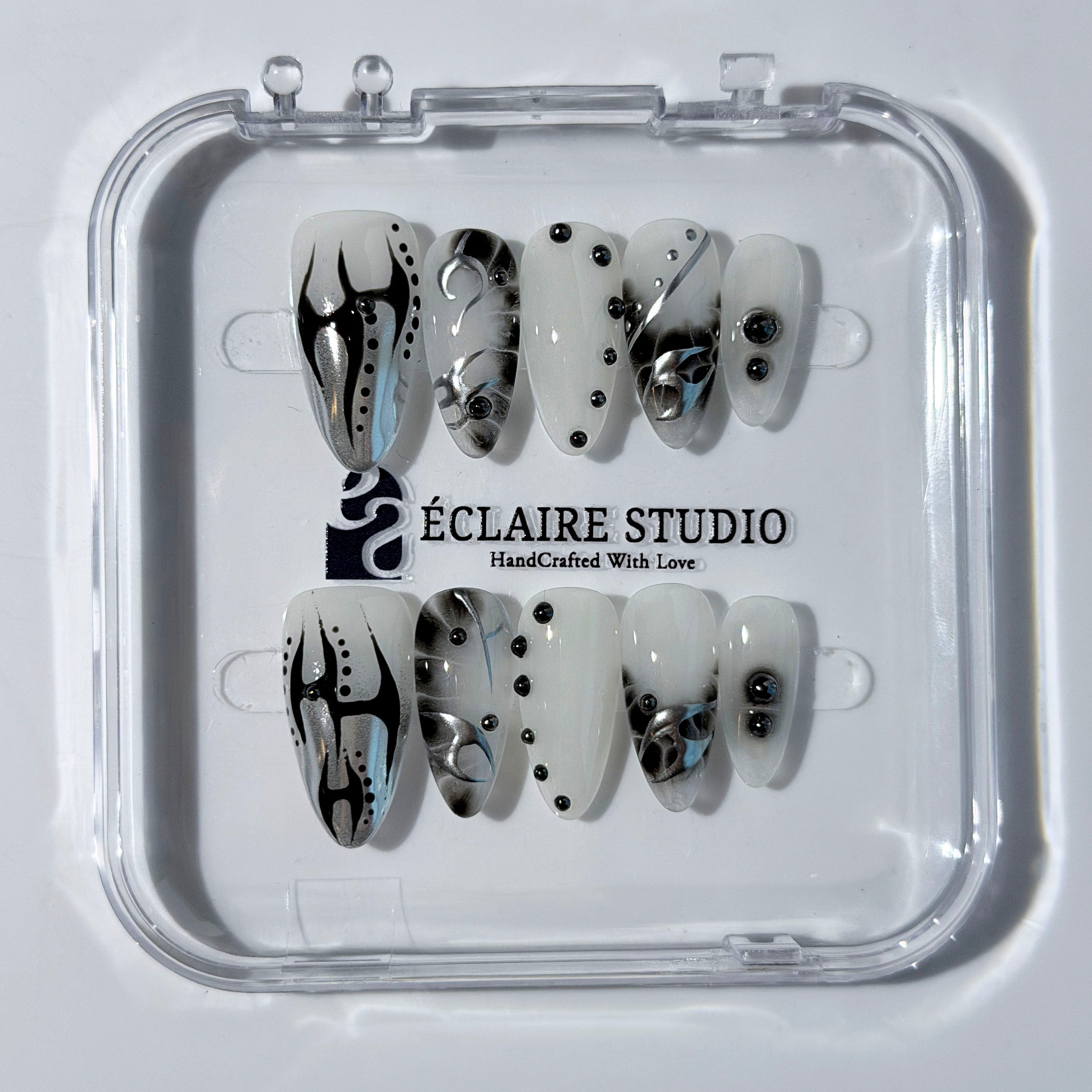 oid Signal press-on nails — a black and grey smoky marble nail design with cyber-inspired line art and glossy onyx studs. Handmade high-fashion nails by Éclaire Nail Studio.