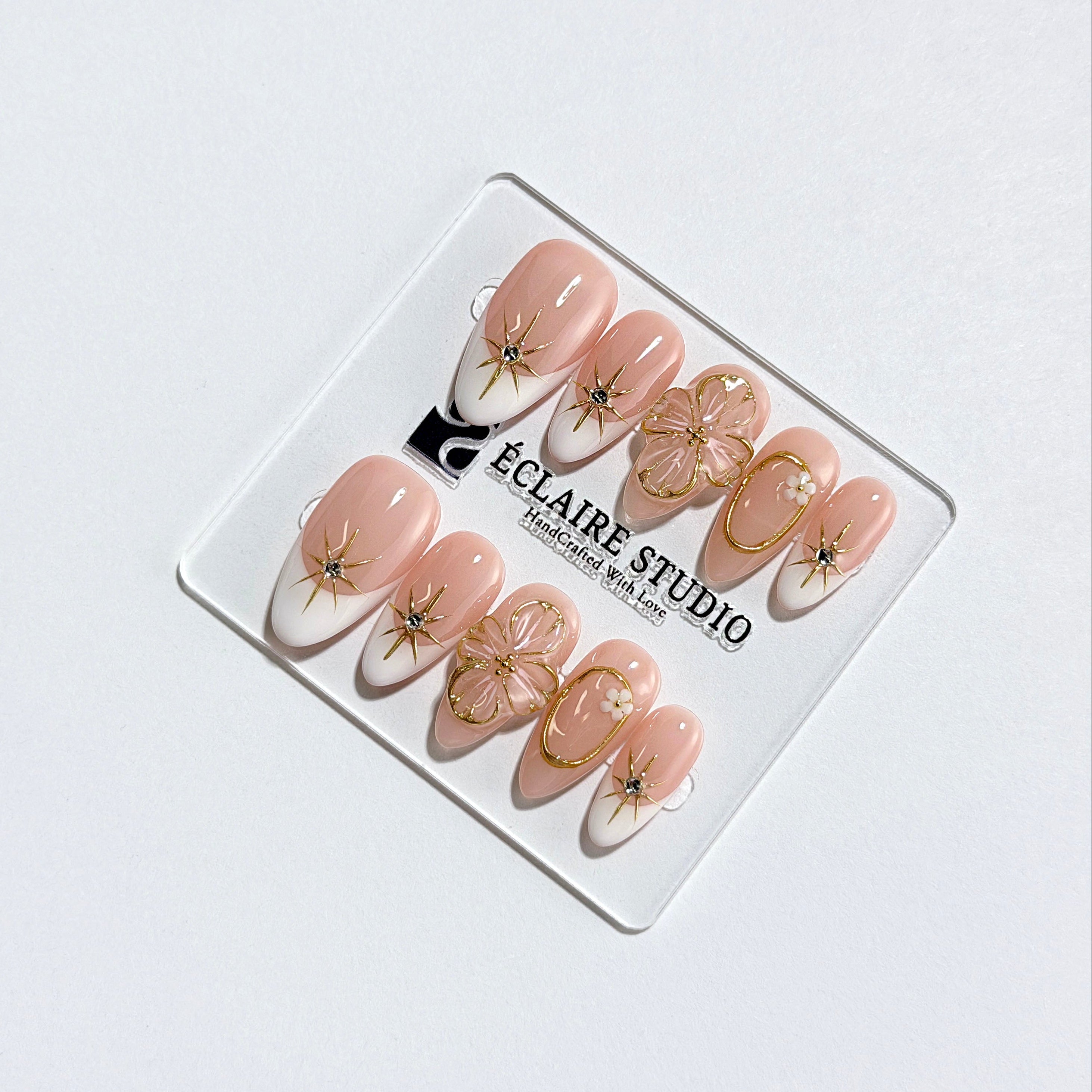 Golden Fleur white French tip press-on nails with 3D cherry blossom florals and gold starbursts – Éclaire Studio