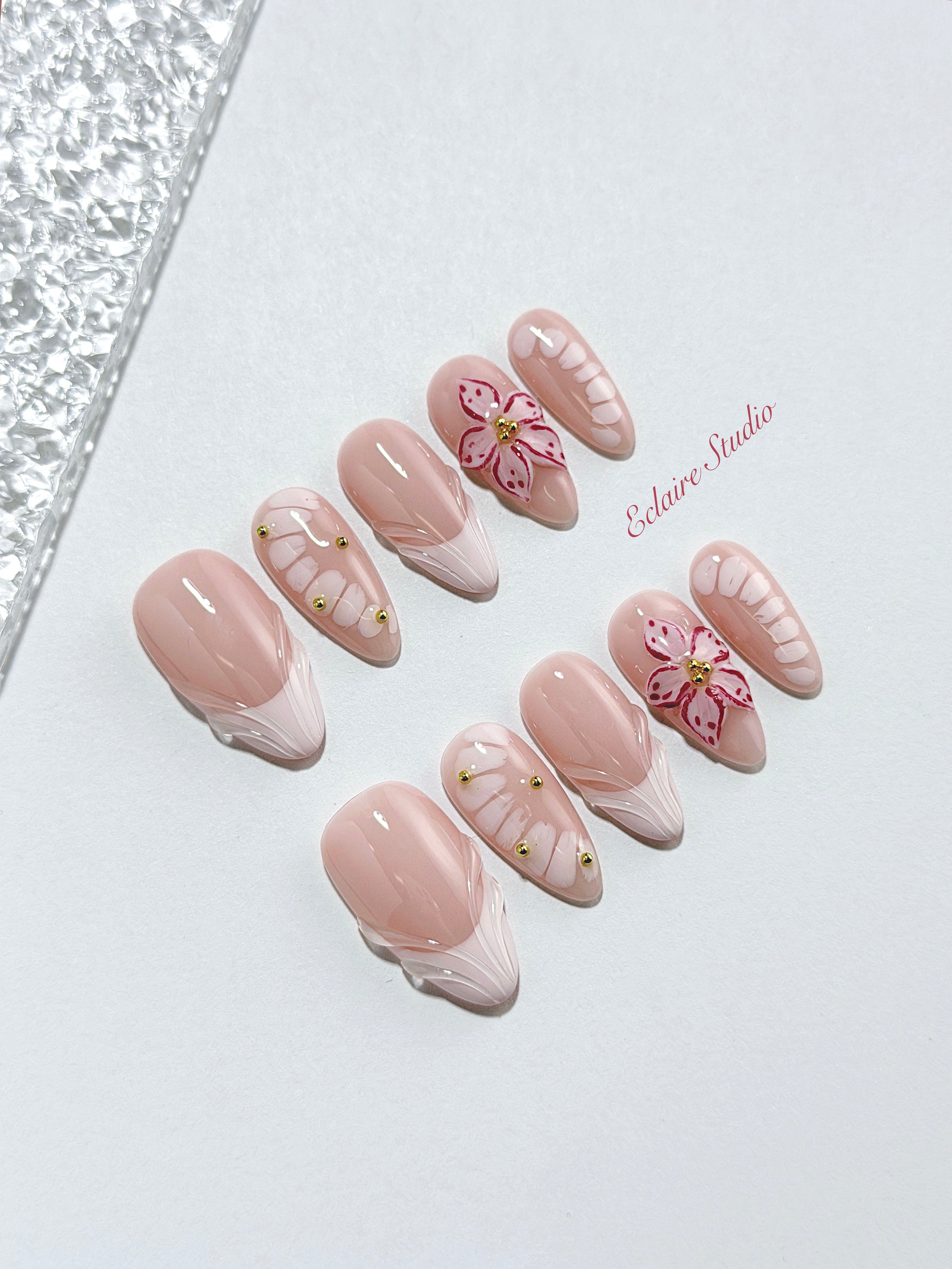 Belle Rose almond press-on nails with milky pink French tips, hand-painted petals and 3D floral accent – Éclaire Studio