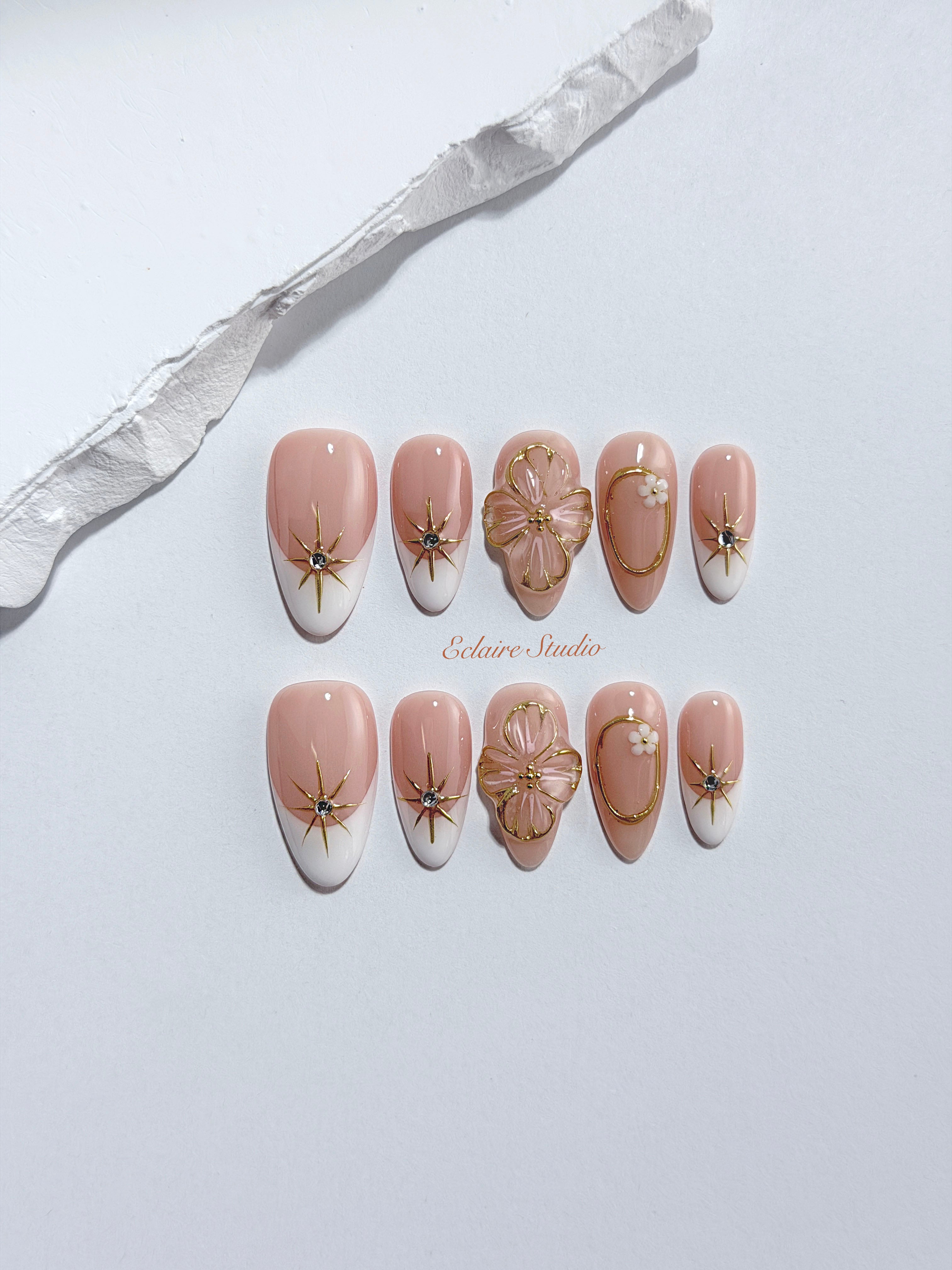 Golden Fleur white French tip press-on nails with 3D cherry blossom florals and gold starbursts – Éclaire Studio
