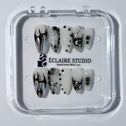 oid Signal press-on nails — a black and grey smoky marble nail design with cyber-inspired line art and glossy onyx studs. Handmade high-fashion nails by Éclaire Nail Studio.