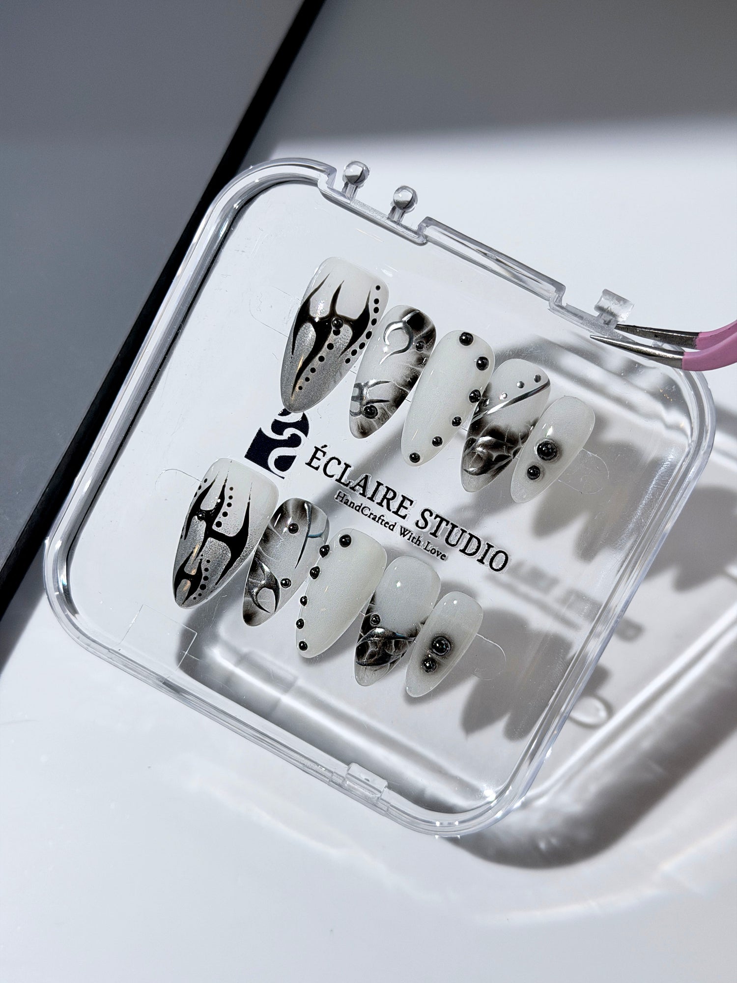 oid Signal press-on nails — a black and grey smoky marble nail design with cyber-inspired line art and glossy onyx studs. Handmade high-fashion nails by Éclaire Nail Studio.