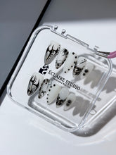 oid Signal press-on nails — a black and grey smoky marble nail design with cyber-inspired line art and glossy onyx studs. Handmade high-fashion nails by Éclaire Nail Studio.