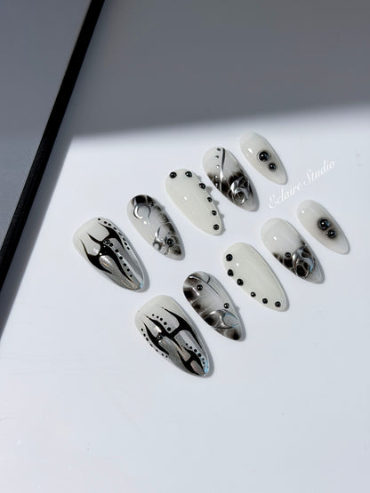oid Signal press-on nails — a black and grey smoky marble nail design with cyber-inspired line art and glossy onyx studs. Handmade high-fashion nails by Éclaire Nail Studio.”
