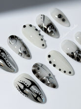 oid Signal press-on nails — a black and grey smoky marble nail design with cyber-inspired line art and glossy onyx studs. Handmade high-fashion nails by Éclaire Nail Studio.”