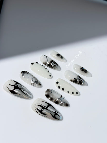 oid Signal press-on nails — a black and grey smoky marble nail design with cyber-inspired line art and glossy onyx studs. Handmade high-fashion nails by Éclaire Nail Studio.”