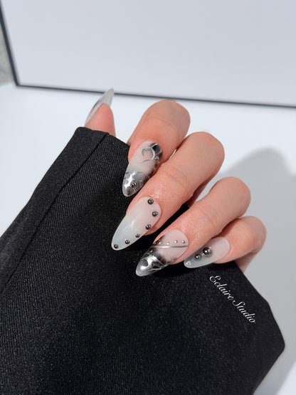 oid Signal press-on nails — a black and grey smoky marble nail design with cyber-inspired line art and glossy onyx studs. Handmade high-fashion nails by Éclaire Nail Studio.”