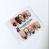 Petal Locket almond press-on nails with nude bases, ivory 3D flowers, brown florals, tortoiseshell, animal-print French tips, pearls, and gold accents.
