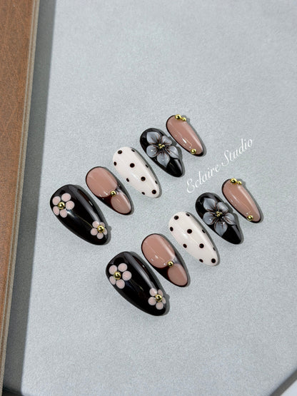 Cocoa Cameo almond press-on nails with espresso and blush bases, polka dots, sculpted flowers and gold beads – Éclaire Studio