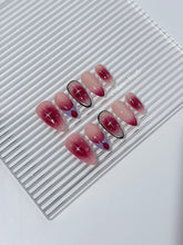 Plum and blush ombré nails with star accents and abstract black outlines — Sugar Plum Fairy–inspired.