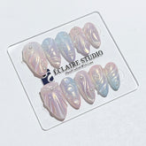 Handcrafted luxury press-on nails in a medium almond shape featuring an iridescent multi-toned glazed finish with 3D sculpted shell ridges and delicate mini pearls.