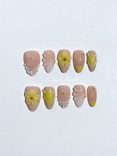 Eclaire Studio Yellow Summer short almond press-on nails featuring a sheer nude base with yellow French tips, hand-sculpted 3D flowers, frosted 3D seashells