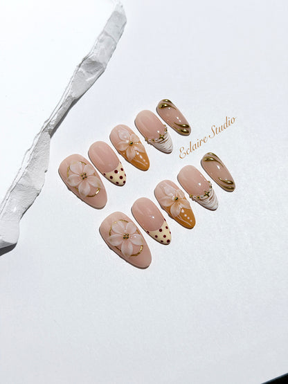 Madeleine press-on nails with 3D white florals on a toasted-cream base – Éclaire Studio
