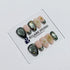 Bali Escape almond press-on nails with emerald cat-eye shimmer, 3D frosted flowers and gold accents – Éclaire Studio