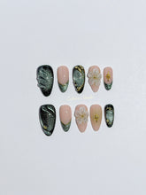 Bali Escape almond press-on nails with emerald cat-eye shimmer, 3D frosted flowers and gold accents – Éclaire Studio