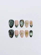 Bali Escape almond press-on nails with emerald cat-eye shimmer, 3D frosted flowers and gold accents – Éclaire Studio