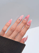 Luxury press-on nails featuring a soft blush pink ombre base with white French tips, a translucent 3D jellyfish, a sculpted pink starfish, and a clear 3D glass flower with a pearl center.