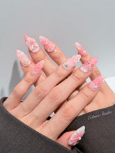 Luxury press-on nails featuring a soft blush pink ombre base with white French tips, a translucent 3D jellyfish, a sculpted pink starfish, and a clear 3D glass flower with a pearl center.