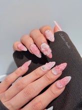 Luxury press-on nails featuring a soft blush pink ombre base with white French tips, a translucent 3D jellyfish, a sculpted pink starfish, and a clear 3D glass flower with a pearl center.