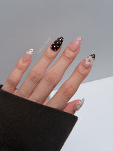 Eclaire Nail Studio 3D Floral Polka dot pink base with alternating black and white polka dot French tips, and hand-sculpted 3D frosted white flowers with gold bead centers, Short Almond