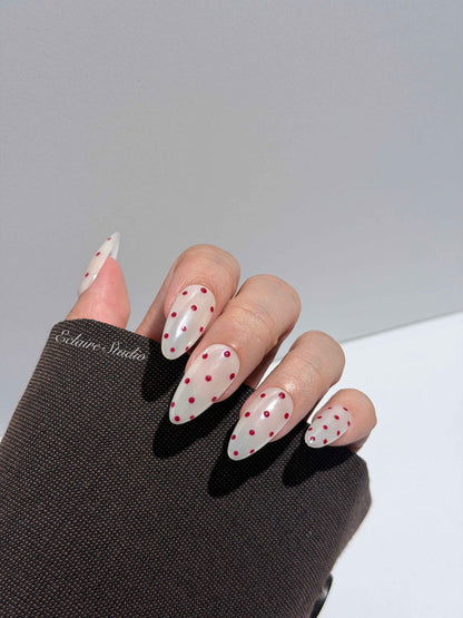 Spritz glazed pearlescent press-on nails with hand-placed polka dots – Éclaire Studio