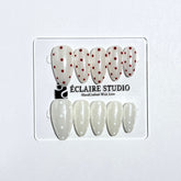 Spritz glazed pearlescent press-on nails with hand-placed polka dots – Éclaire Studio