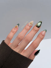 Bali Escape almond press-on nails with emerald cat-eye shimmer, 3D frosted flowers and gold accents – Éclaire Studio