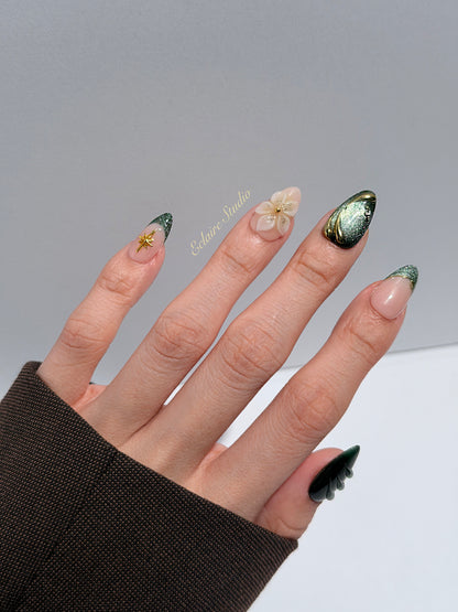 Bali Escape almond press-on nails with emerald cat-eye shimmer, 3D frosted flowers and gold accents – Éclaire Studio