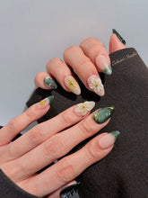 Bali Escape almond press-on nails with emerald cat-eye shimmer, 3D frosted flowers and gold accents – Éclaire Studio