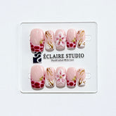 Marbella square press-on nails with wine watercolor French tips, gold swirls, starfish charms and 3D lily – Éclaire Studio