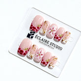 Marbella square press-on nails with wine watercolor French tips, gold swirls, starfish charms and 3D lily – Éclaire Studio