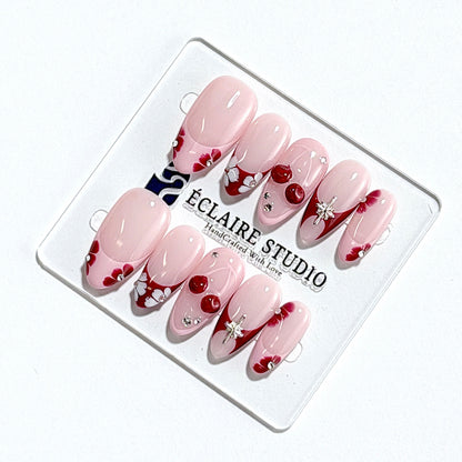 Cherry Kiss pink French press-on nails with wine florals, glossy 3D cherries and silver charms – Éclaire Studio