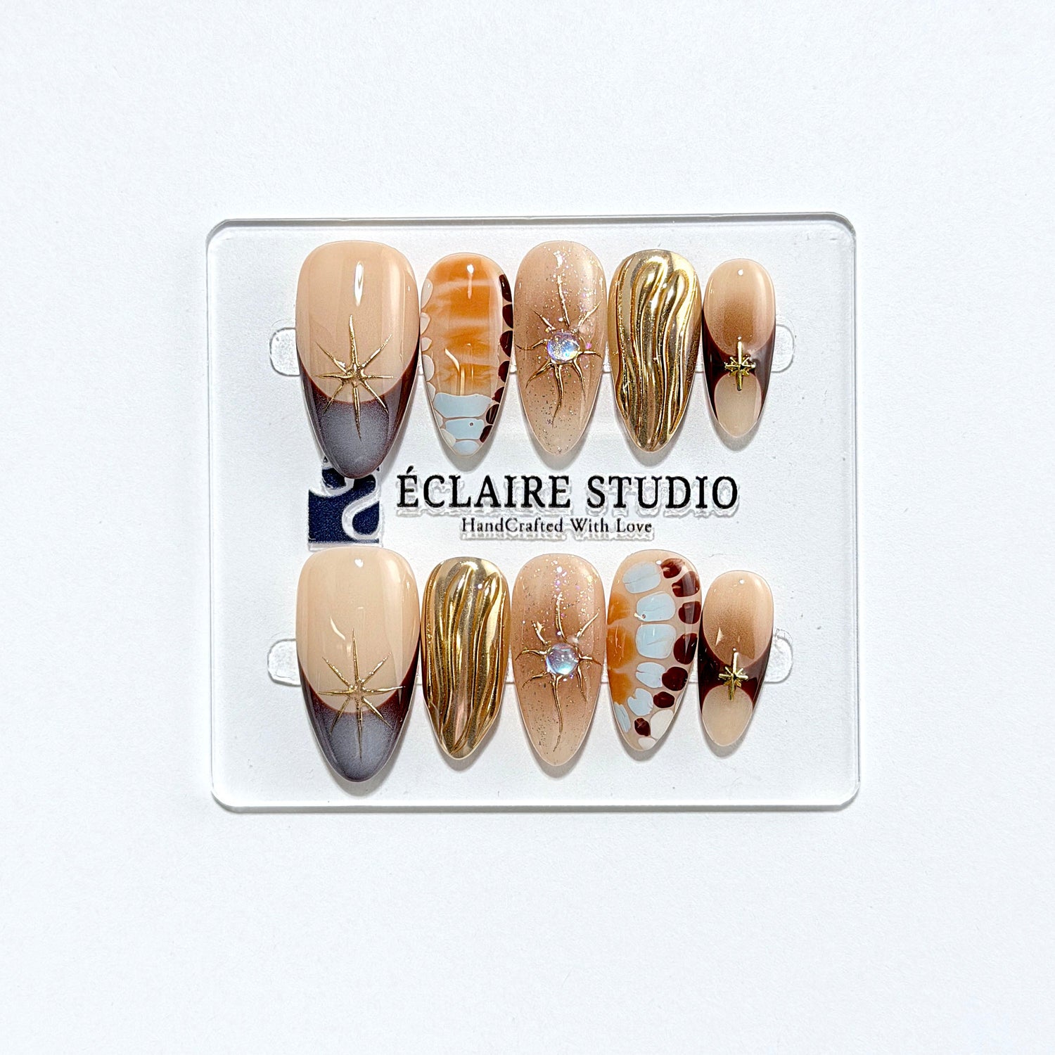 Dune caramel and espresso press-on nails with gold chrome wave, starbursts and opal gem – Éclaire Studio