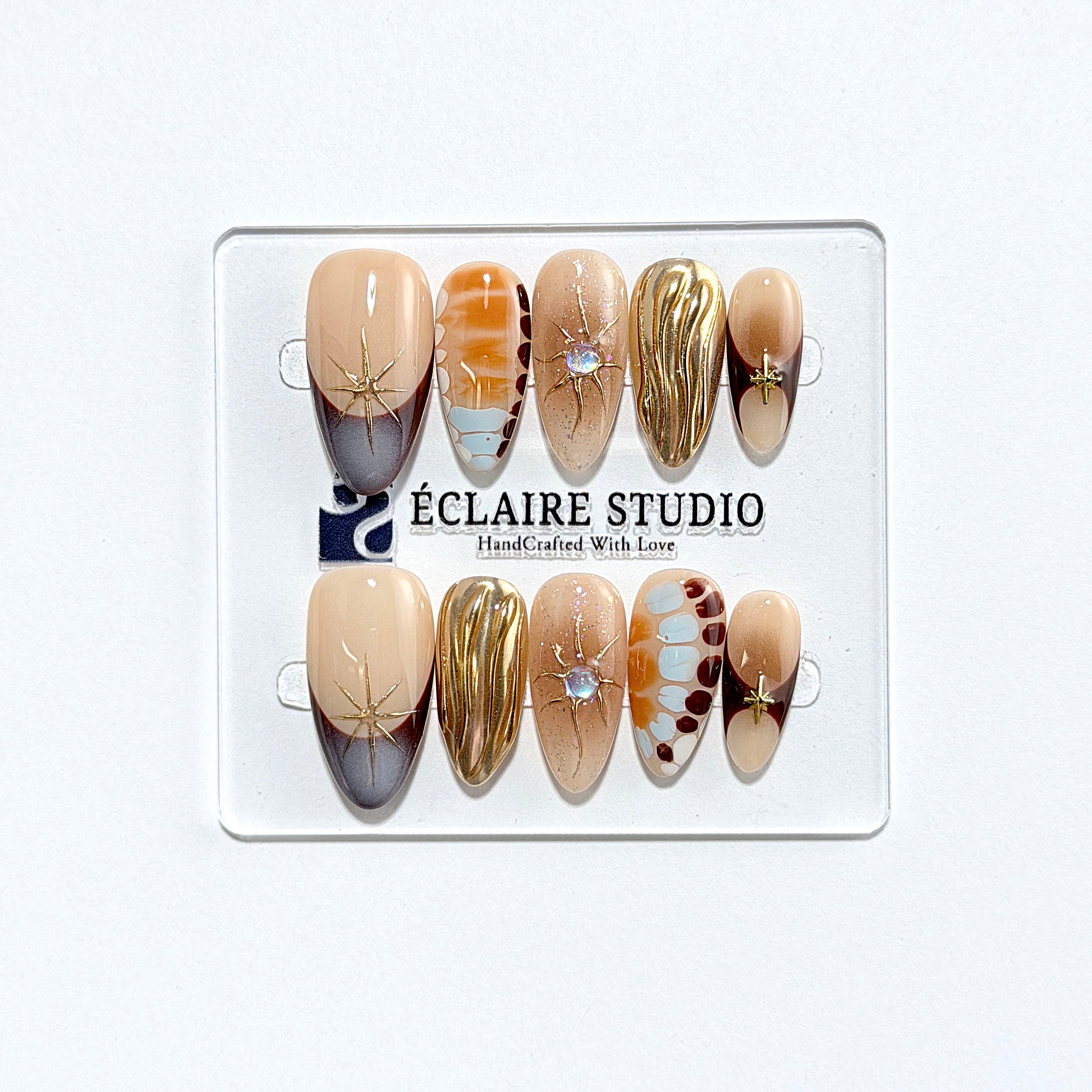 Dune caramel and espresso press-on nails with gold chrome wave, starbursts and opal gem – Éclaire Studio