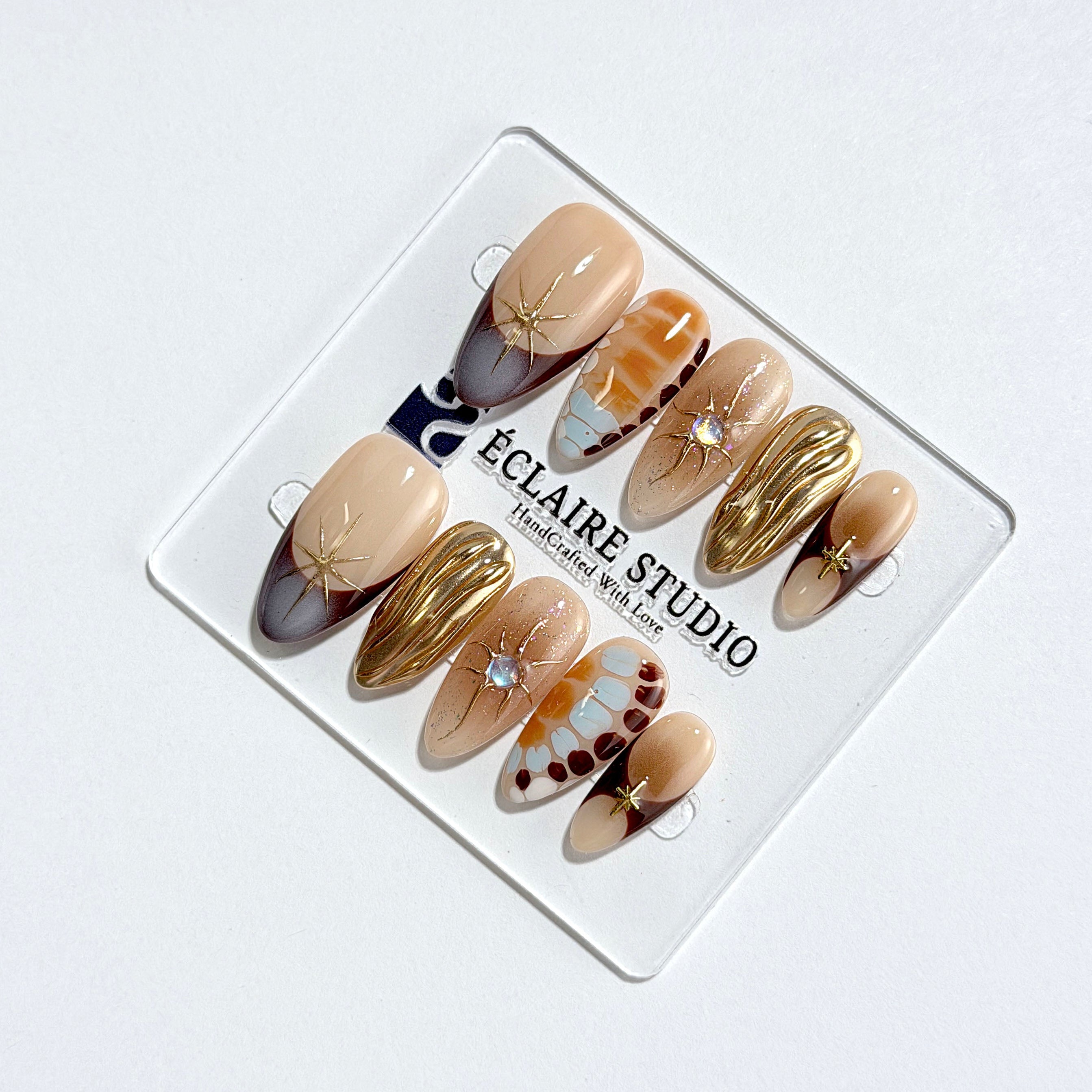 Dune caramel and espresso press-on nails with gold chrome wave, starbursts and opal gem – Éclaire Studio