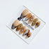 Dune caramel and espresso press-on nails with gold chrome wave, starbursts and opal gem – Éclaire Studio