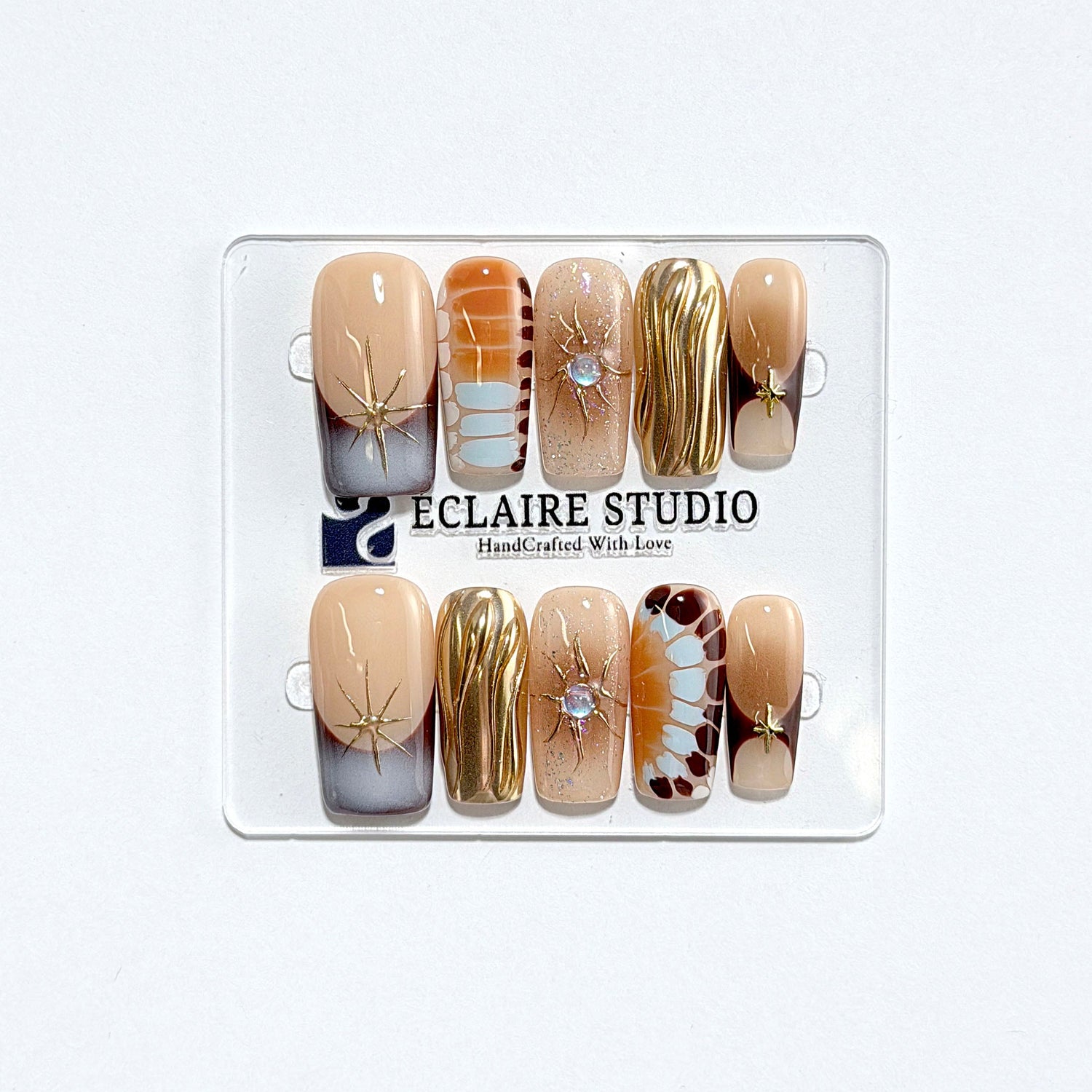 Dune caramel and espresso press-on nails with gold chrome wave, starbursts and opal gem – Éclaire Studio