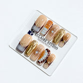 Dune caramel and espresso press-on nails with gold chrome wave, starbursts and opal gem – Éclaire Studio