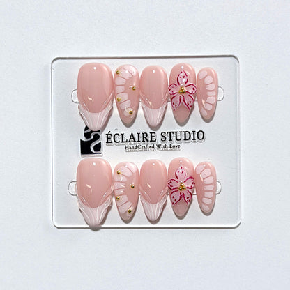 Belle Rose almond press-on nails with milky pink French tips, hand-painted petals and 3D floral accent – Éclaire Studio