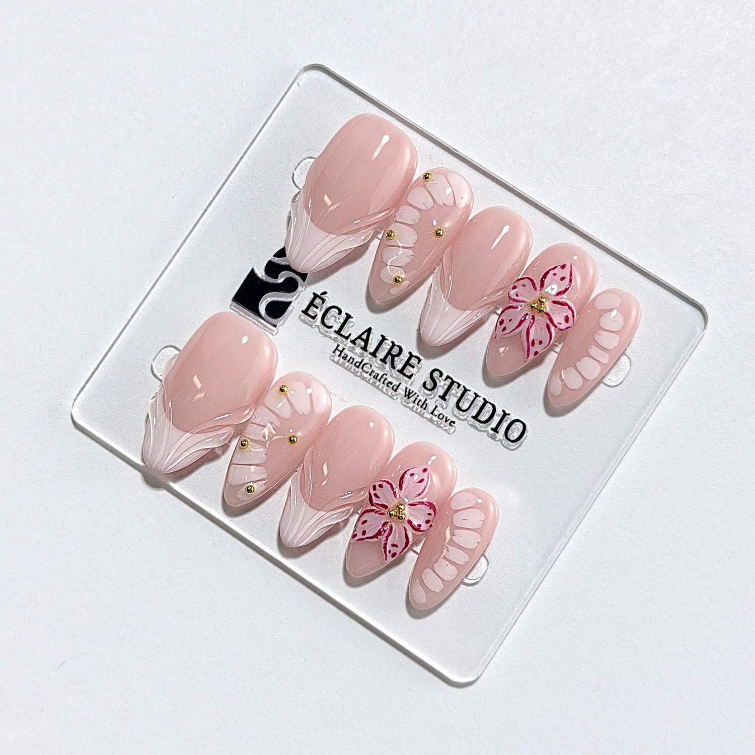 Belle Rose almond press-on nails with milky pink French tips, hand-painted petals and 3D floral accent – Éclaire Studio