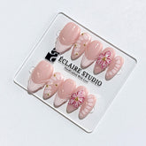 Belle Rose almond press-on nails with milky pink French tips, hand-painted petals and 3D floral accent – Éclaire Studio