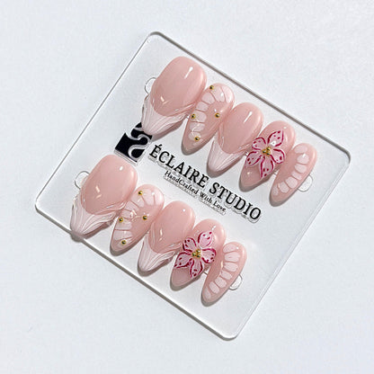 Belle Rose almond press-on nails with milky pink French tips, hand-painted petals and 3D floral accent – Éclaire Studio