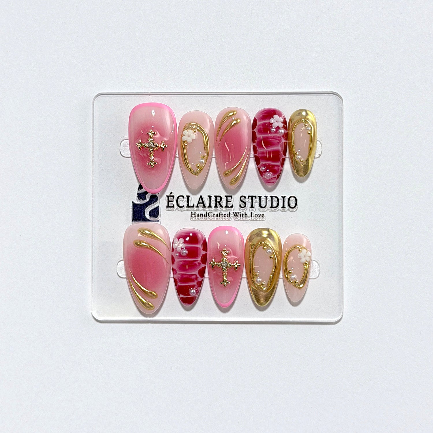 Strawberry Latte red ombré press-on nails with molten gold frames and floral accents – Éclaire Studio