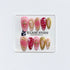 Strawberry Latte red ombré press-on nails with molten gold frames and floral accents – Éclaire Studio