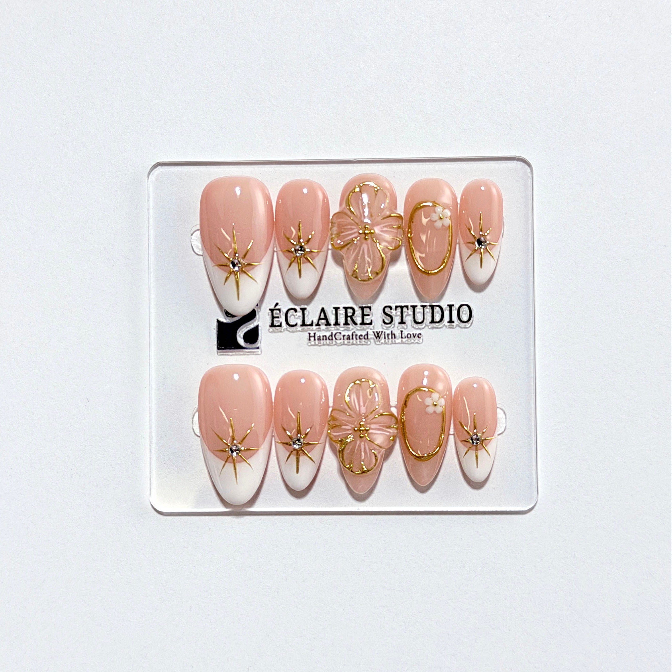 Golden Fleur white French tip press-on nails with 3D cherry blossom florals and gold starbursts – Éclaire Studio