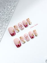 Marbella square press-on nails with wine watercolor French tips, gold swirls, starfish charms and 3D lily – Éclaire Studio