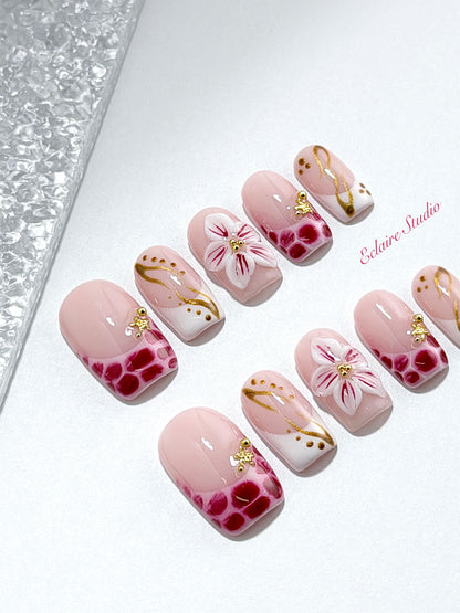 Marbella square press-on nails with wine watercolor French tips, gold swirls, starfish charms and 3D lily – Éclaire Studio
