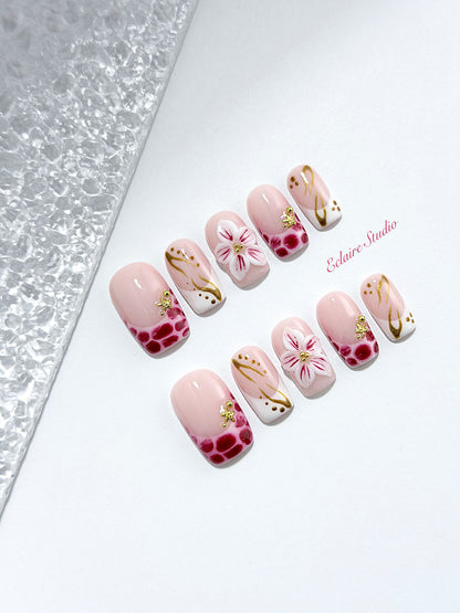 Marbella square press-on nails with wine watercolor French tips, gold swirls, starfish charms and 3D lily – Éclaire Studio