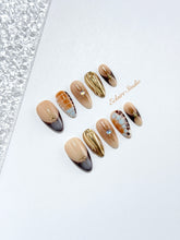 Dune caramel and espresso press-on nails with gold chrome wave, starbursts and opal gem – Éclaire Studio
