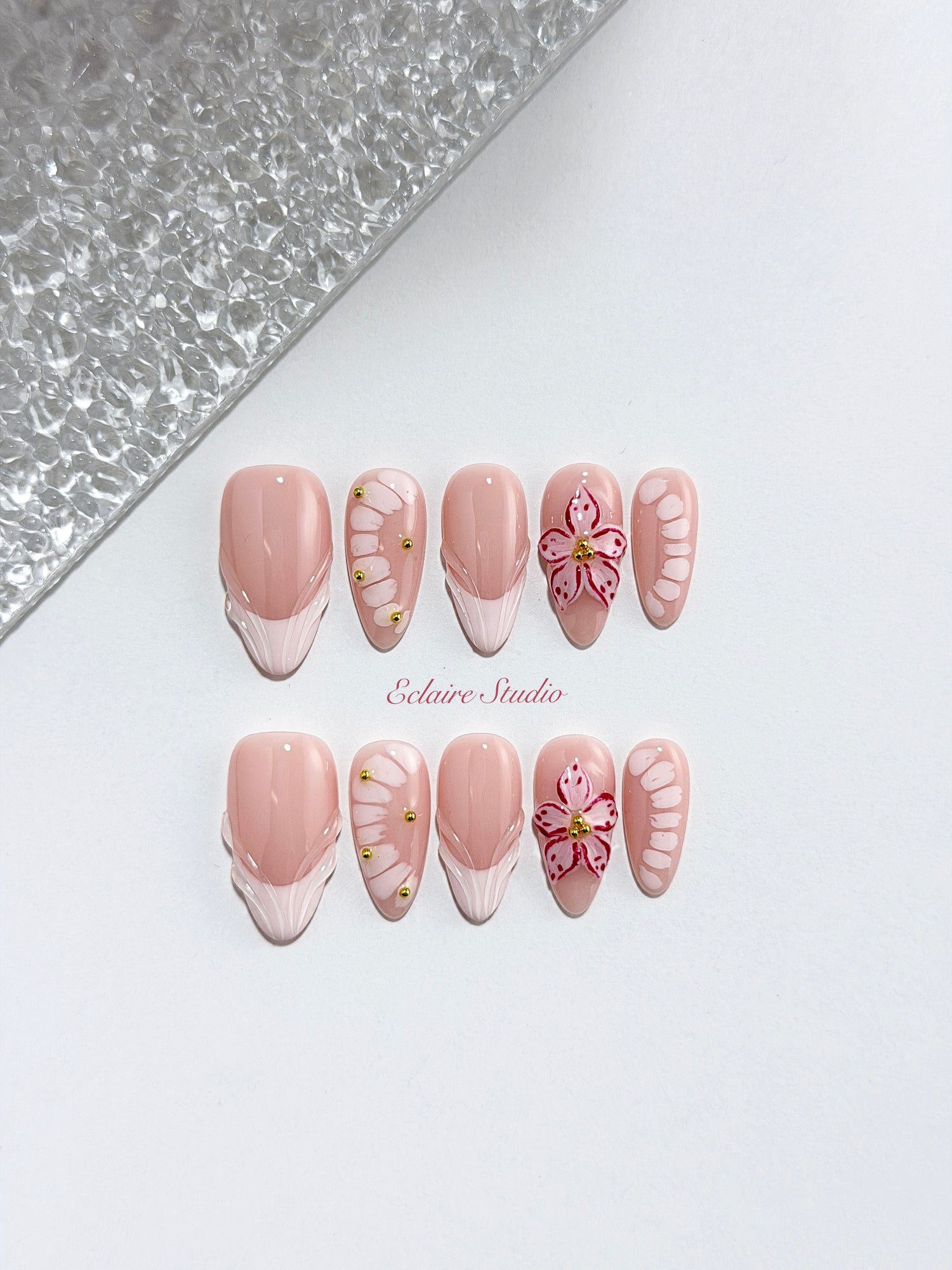 Belle Rose almond press-on nails with milky pink French tips, hand-painted petals and 3D floral accent – Éclaire Studio